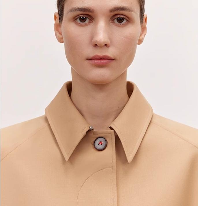 Firelady Fur Fragrant Moment Coat by Maison Beaumont, stylish outerwear with plush fabric and elegant design, displayed on a hanger.