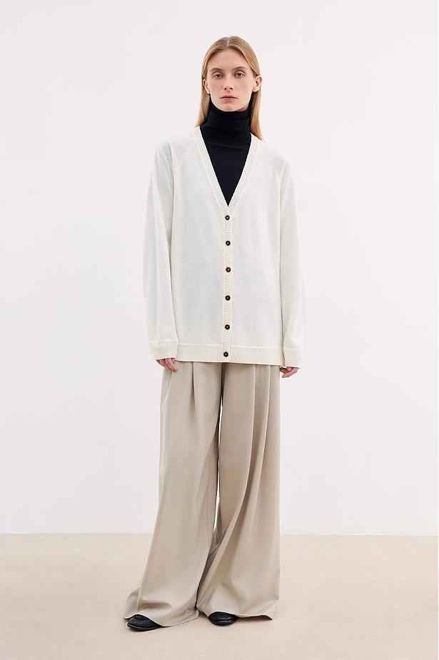 Firelady Fur merino wool knitted V-neck cardigan in a loose fit, featuring soft Australian Merino wool and classic style.