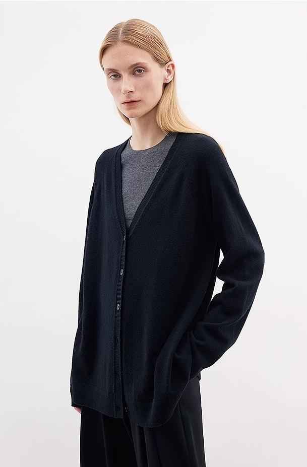 Firelady Fur Merino Wool knitted V-neck cardigan in a loose fit, featuring soft Australian Merino wool and a classic V-neck design.
