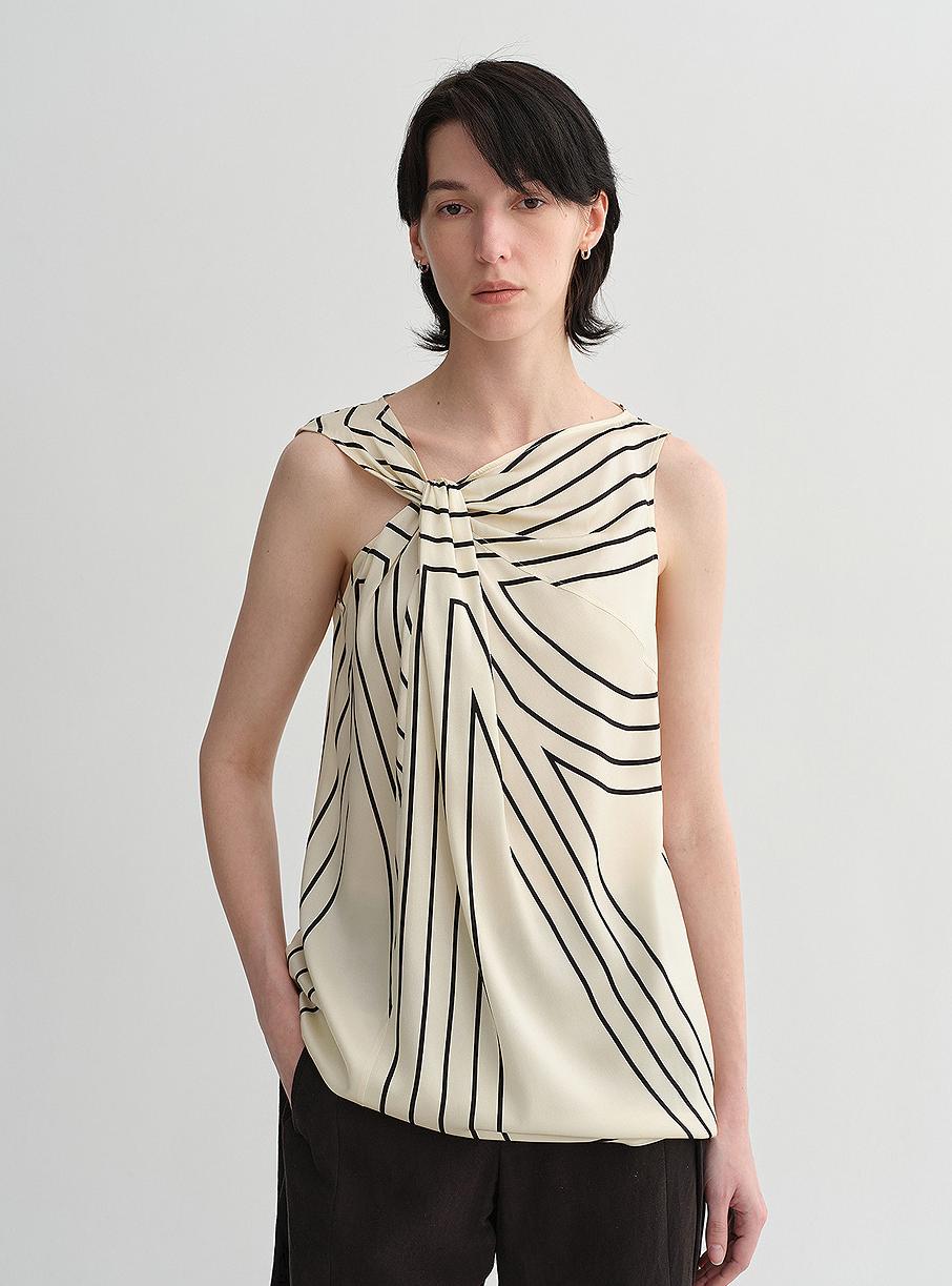 Silk sleeveless shirt by Maison Élvorain featuring a twisted collar and geometric print, slim fit top for women.