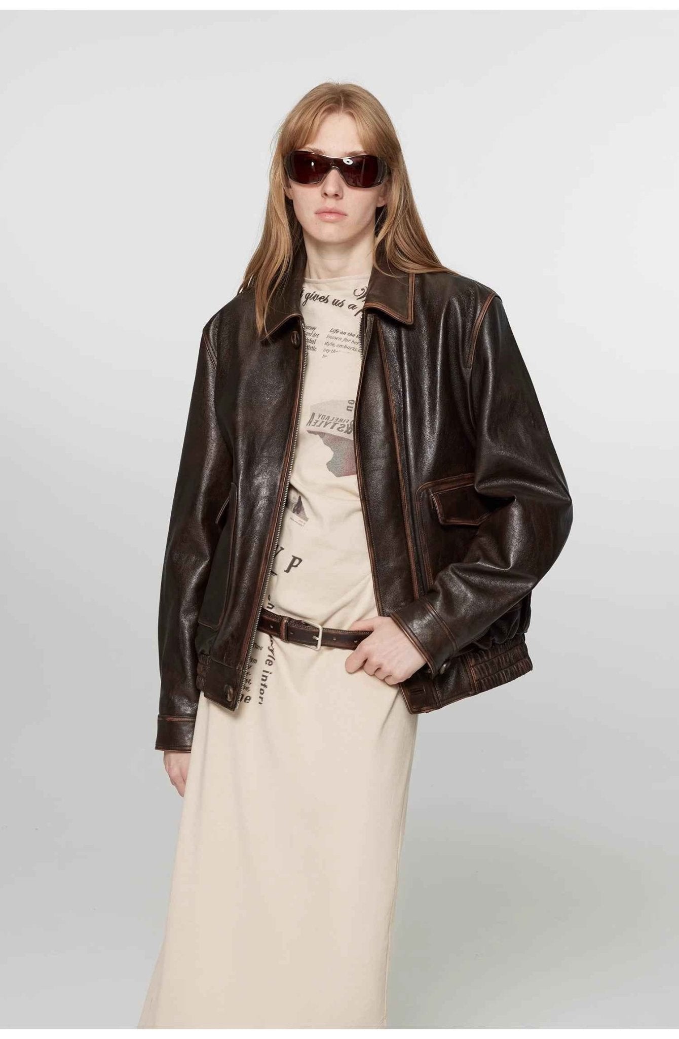 Vintage brown leather jacket for women by Firelady Fur, aviator style with classic leather details.