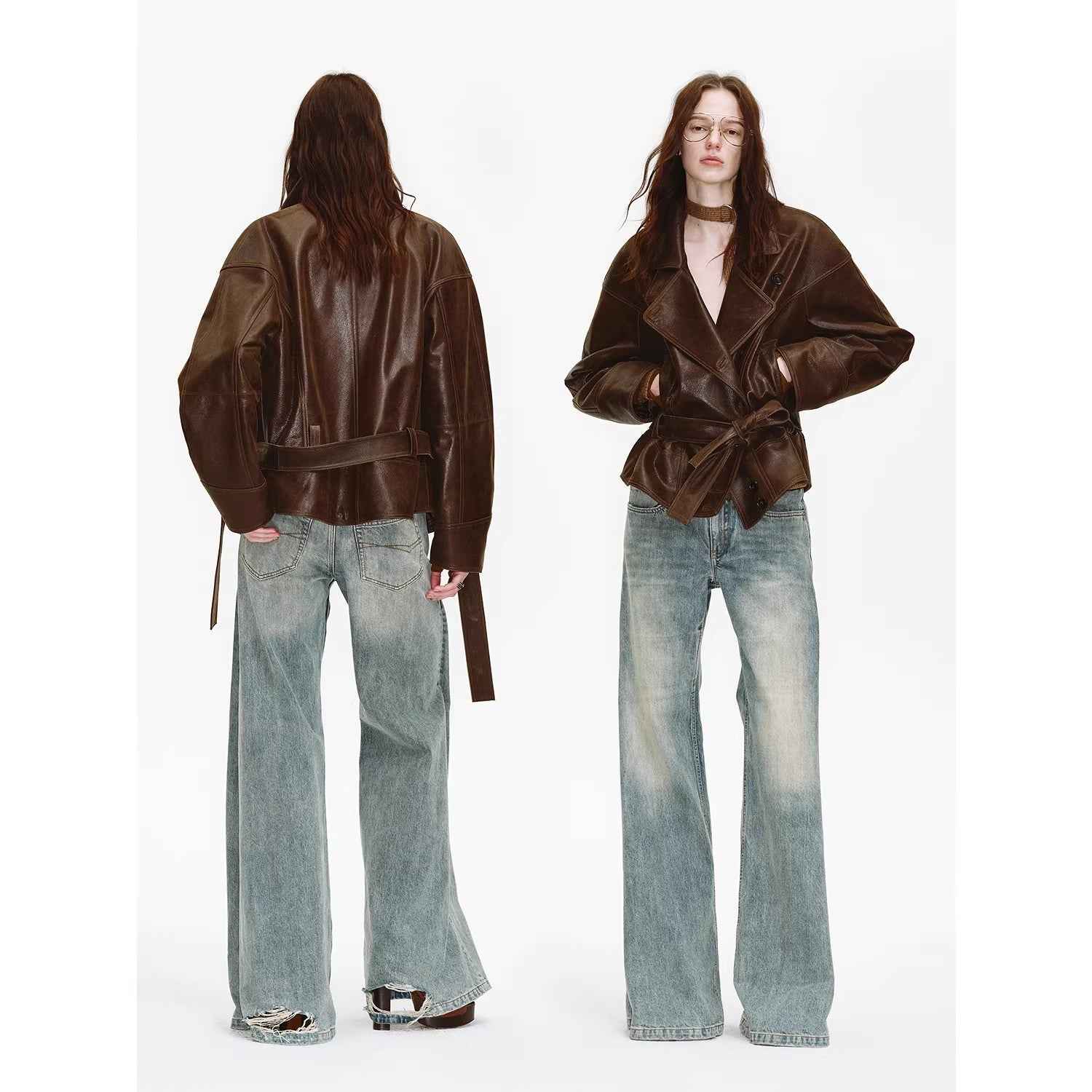 Women's black waxed sheepskin biker coat by Firelady Fur with belt and asymmetric lapel, stylish and durable leather jacket.
