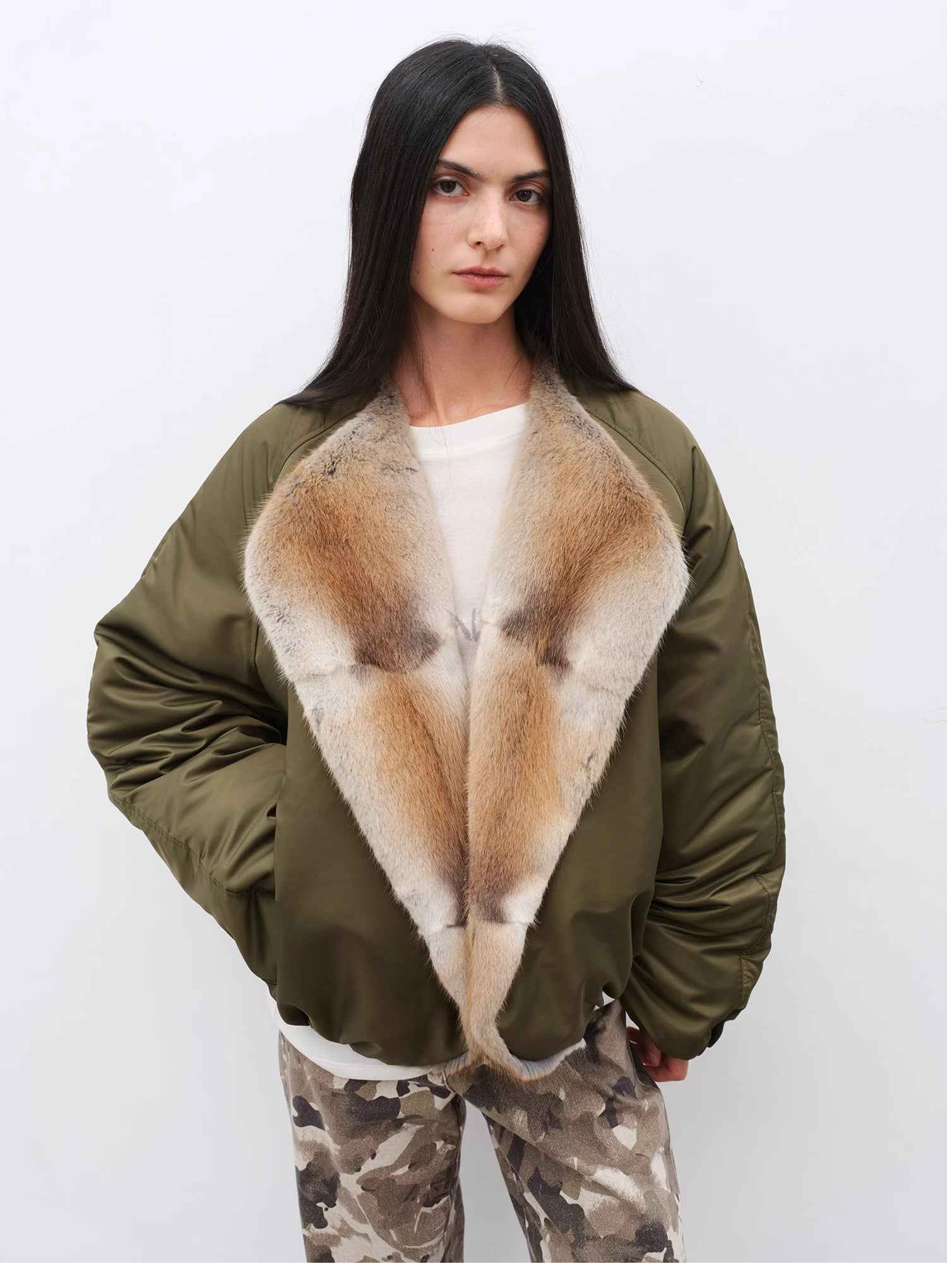 Women's colorblock parka by Firelady Fur with sable muskrat fur collar and goose down insulation for warmth and style.