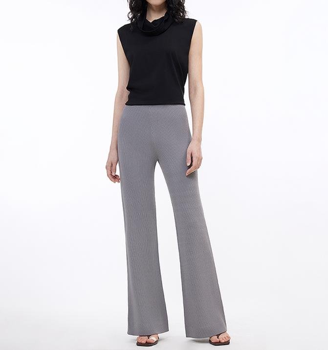 Woman wearing knitted bootcut trousers with rice grain texture and pit stripe casual pattern, stylish women's pants by Firelady Fur.