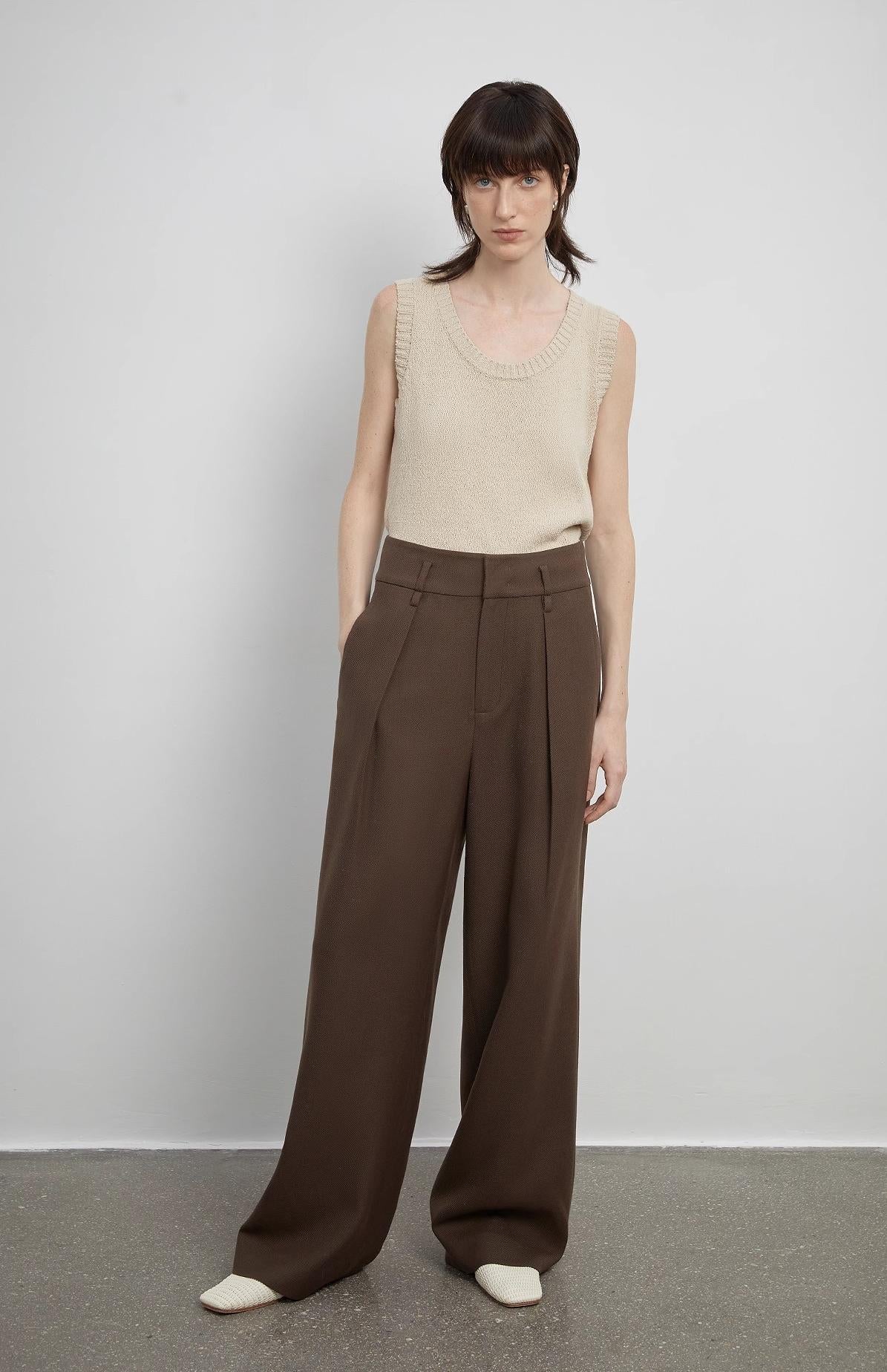 White women's wide-leg pants from Firelady Fur, casual straight-fit with a high waist, drape detail, and floor-length design.